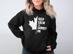 Black hoodie with white Canadian maple leaf and "Keep Calm and Carney On" text.
