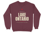 Maroon sweatshirt with "STILL LAKE ONTARIO ON MAPS SINCE THE 1600s" text.