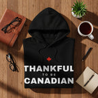 Black hoodie with "Thankful to be Canadian" text and a red maple leaf.