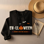 Black sweatshirt with "EH-LLWEEN" text, pumpkin, bats, and "SORRY FOR THE SCARE".