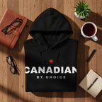 Black hoodie with red maple leaf and "CANADIAN BY CHOICE" text.
