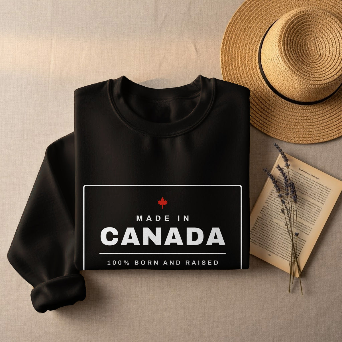 Black sweatshirt with "Made in Canada" and "100% Born and Raised" text.