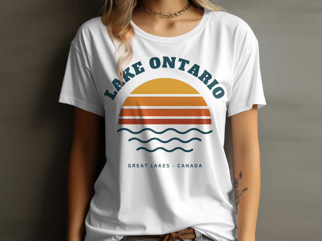 White t-shirt with "Lake Ontario Great Lakes Canada" text and sunset graphic.