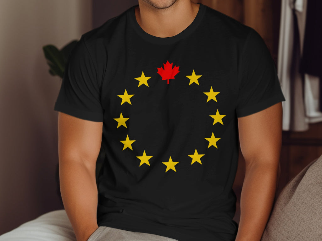 Black t-shirt with yellow stars in a circle and a red maple leaf in the center.