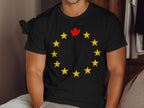 Black t-shirt with yellow stars in a circle and a red maple leaf in the center.