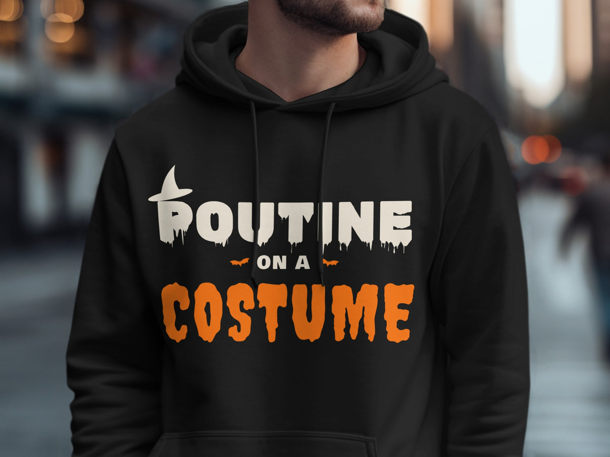 Black hoodie with white "ROUTINE" and orange "COSTUME" text and Halloween bats.