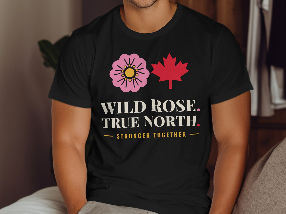Black t-shirt with pink wild rose, red maple leaf, and text.
