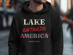 Black hoodie with "LAKE ONTARIO" crossed out and "AMERICA CORRECTED" text.