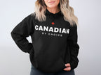 Black hoodie with white text "CANADIAN BY CHOICE" and a red maple leaf.