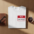 White t-shirt with a red "Hello my name is Lake Ontario (Still)" name tag.