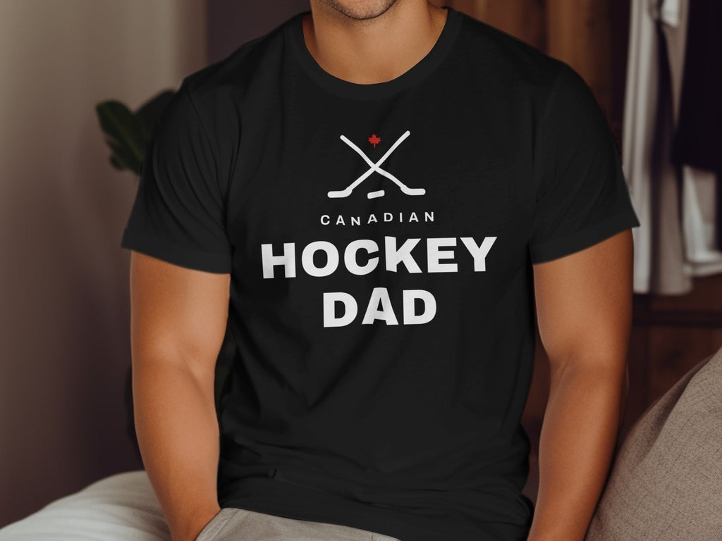 Black t-shirt with white "CANADIAN HOCKEY DAD" text and crossed hockey sticks.