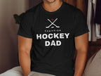 Black t-shirt with white "CANADIAN HOCKEY DAD" text and crossed hockey sticks.