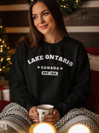 Black sweatshirt with white text reading "Lake Ontario Canada Est. 1615".