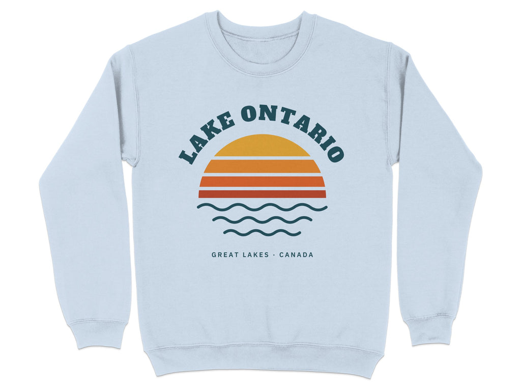 Light blue sweatshirt with "Lake Ontario Great Lakes Canada" text and sunset graphic.
