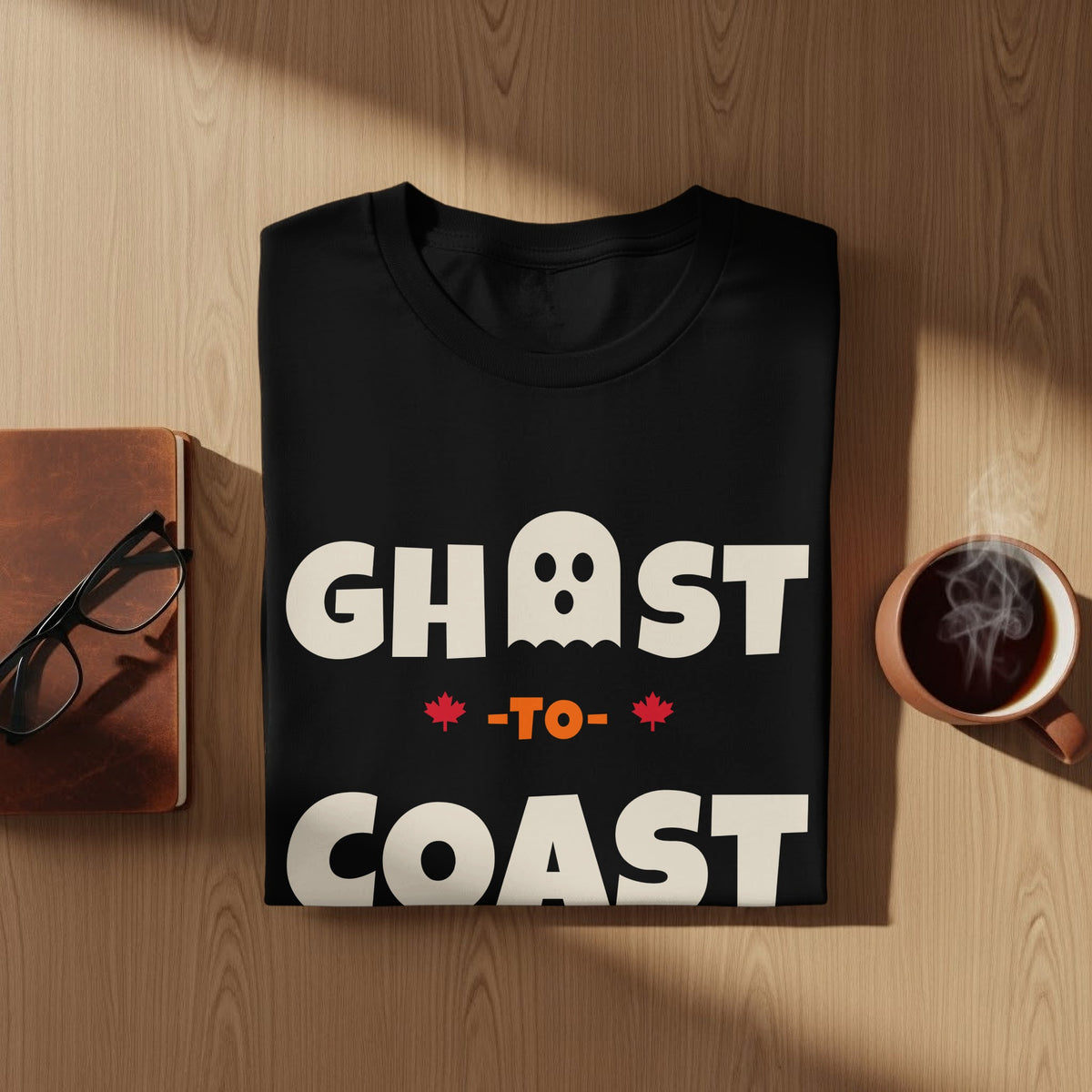 Black t-shirt with "GHOST -TO- COAST" text and ghost graphic.