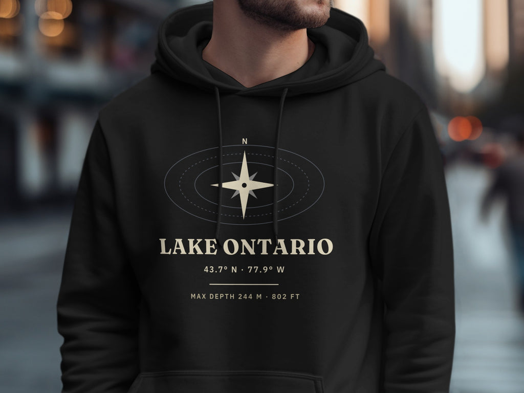 Black hoodie with Lake Ontario design featuring compass, coordinates, and depth.