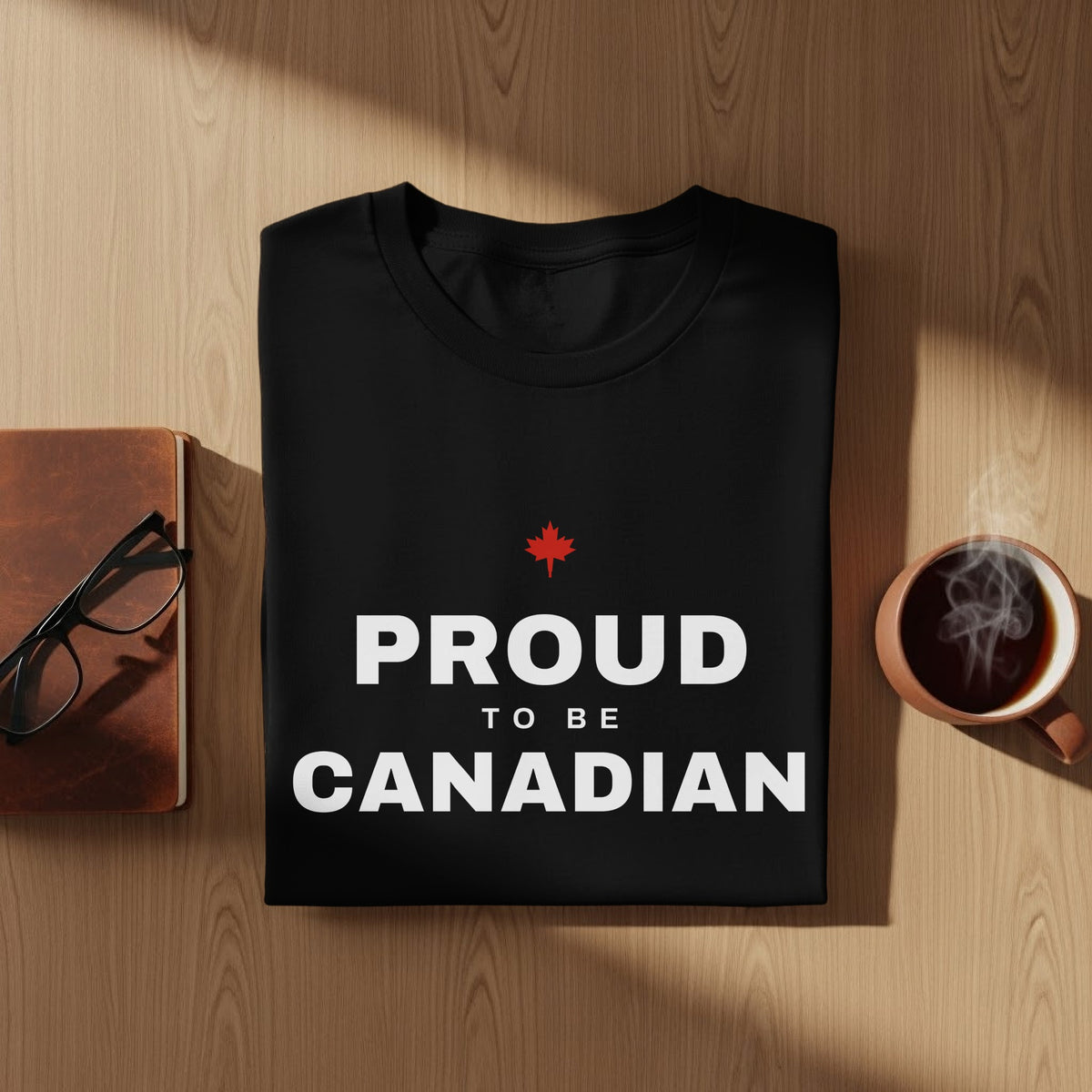 Black t-shirt with "PROUD TO BE CANADIAN" and a maple leaf graphic.