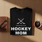 Black t-shirt with "Canadian Hockey Mom" and crossed hockey sticks graphic.