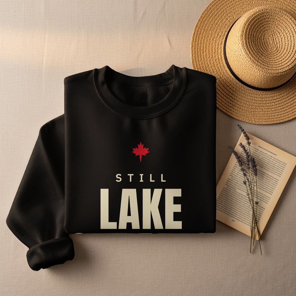 Black sweatshirt with red maple leaf and "STILL LAKE" text.