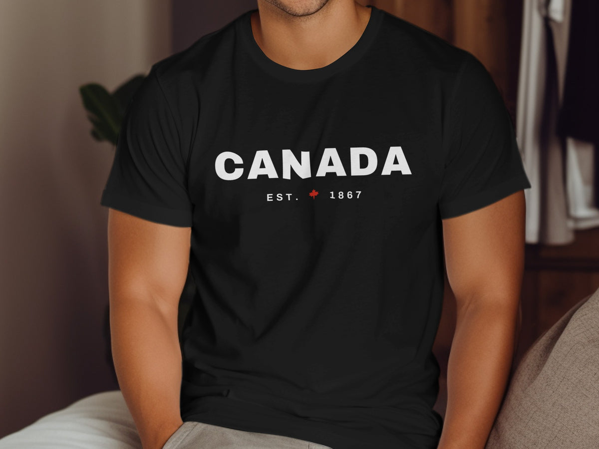 Black t-shirt with "CANADA EST. 1867" and a red maple leaf.