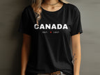 Black t-shirt with white "CANADA EST. 1867" text and red maple leaf.
