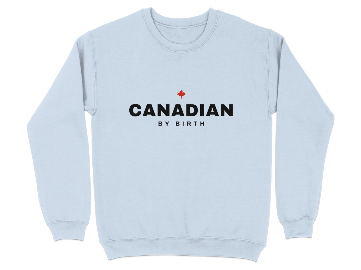Light blue crewneck sweatshirt with "CANADIAN BY BIRTH" and a red maple leaf.