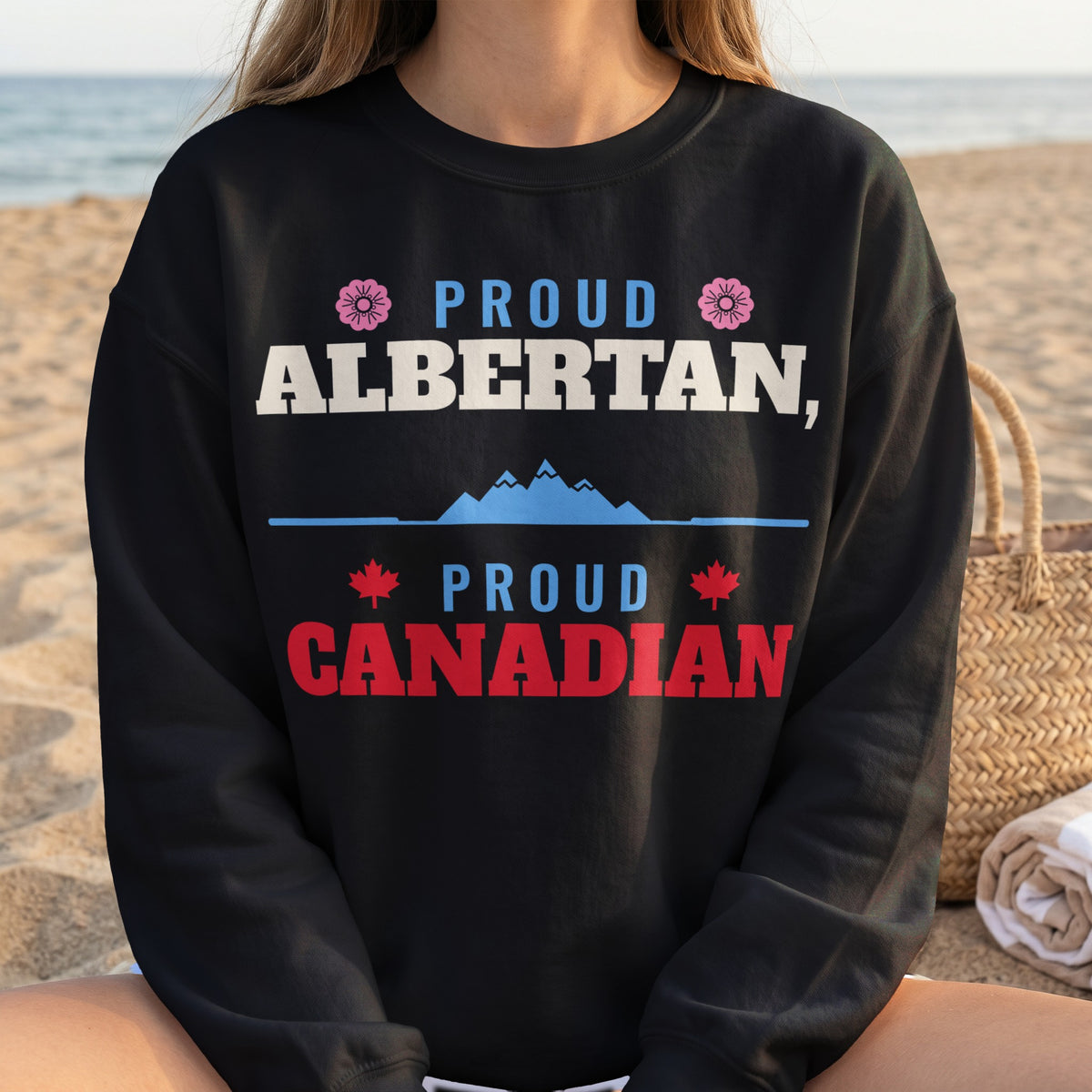 Black sweatshirt with "Proud Albertan, Proud Canadian" text and Canadian maple leaves.