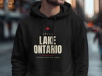 Black hoodie with "Still Lake Ontario On Maps Since The 1600s" text.