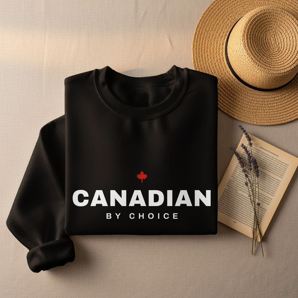 Black sweatshirt with "CANADIAN BY CHOICE" text and a red maple leaf.