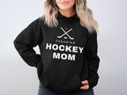 Black hoodie with "CANADIAN HOCKEY MOM" text and crossed hockey sticks with maple leaf.