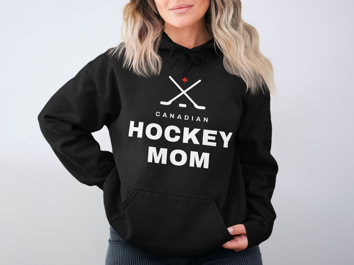 Black hoodie with "CANADIAN HOCKEY MOM" text and crossed hockey sticks with maple leaf.