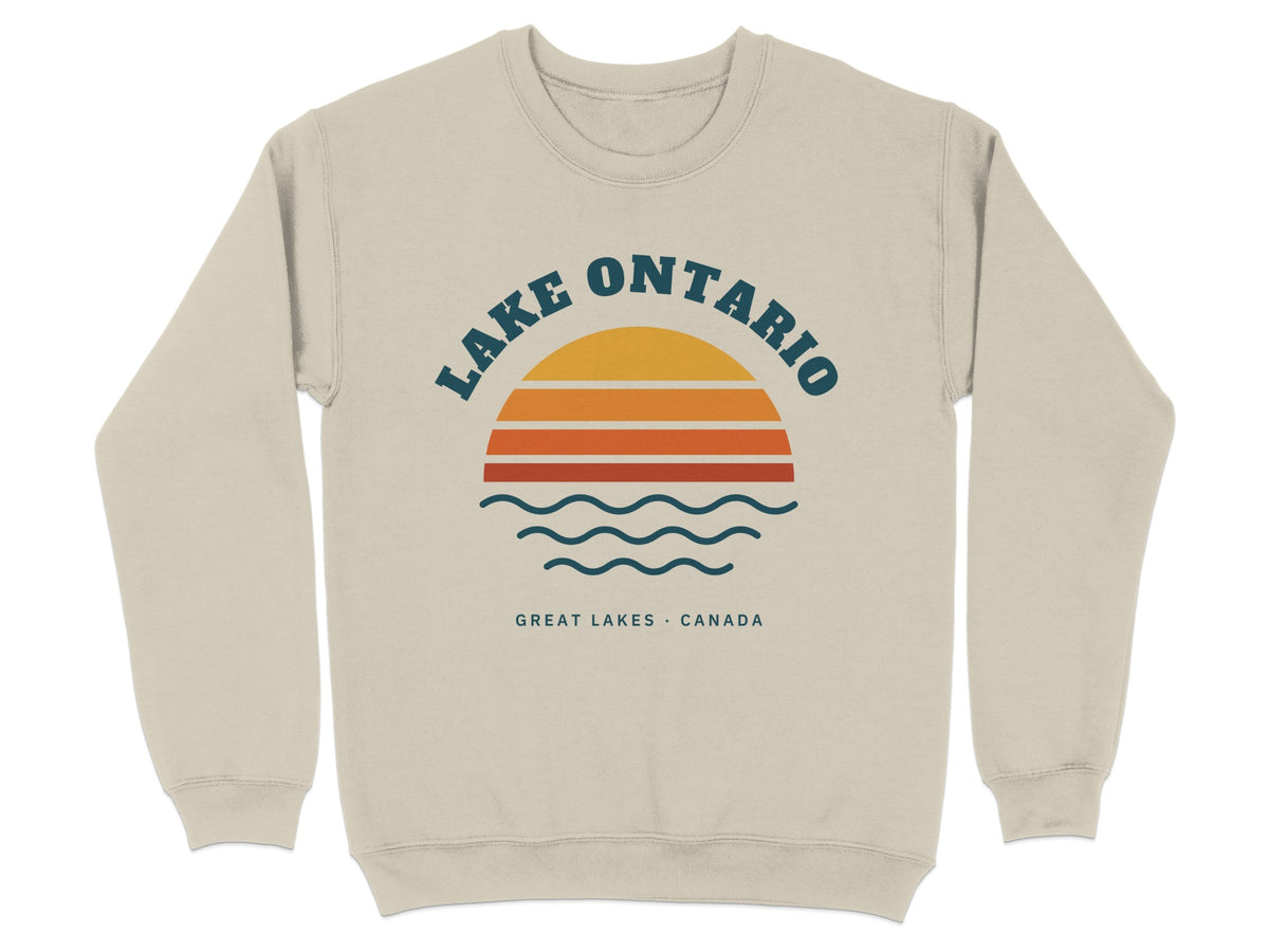 Beige sweatshirt with Lake Ontario graphic featuring sunset and waves.