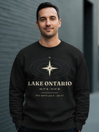 Black sweatshirt with compass graphic and text "LAKE ONTARIO" with coordinates and depth.