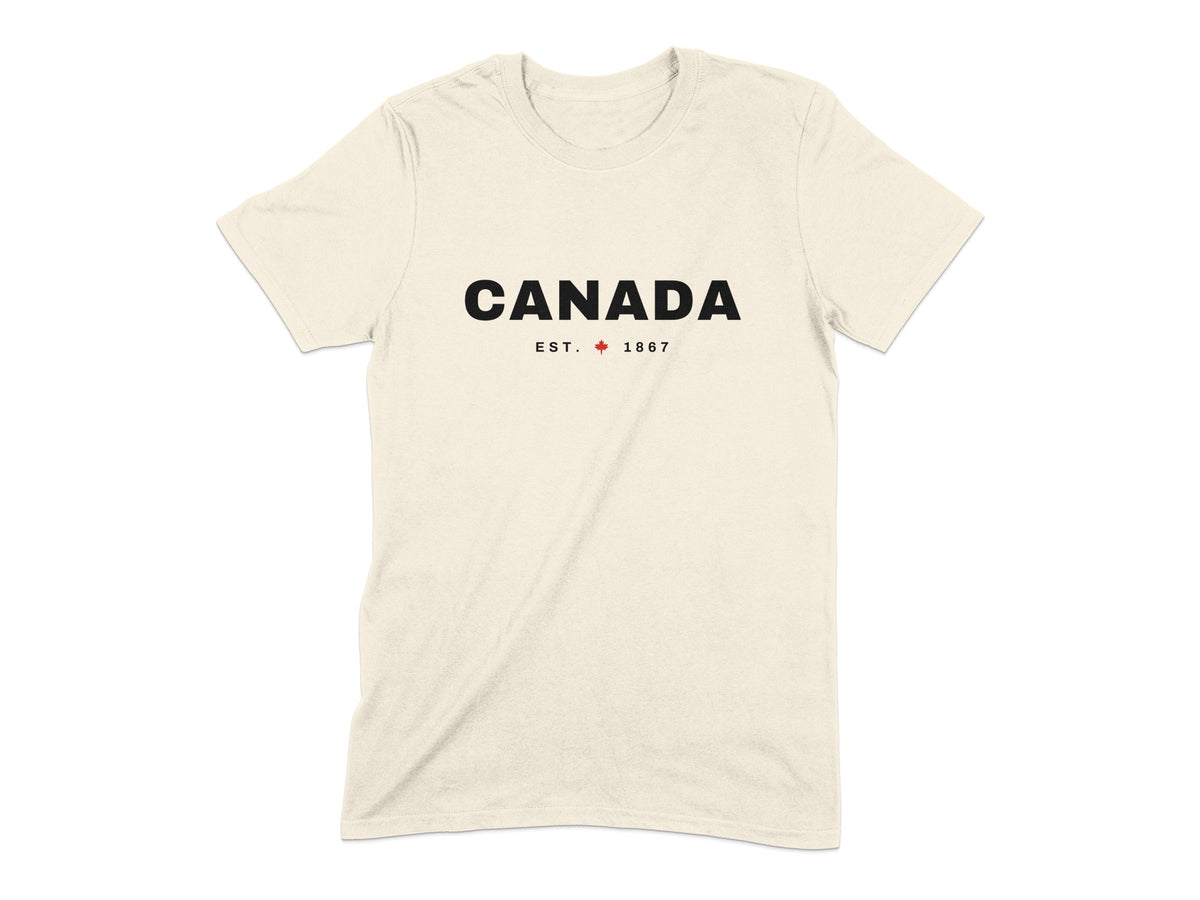 Cream t-shirt with black text "CANADA EST. 1867" and a red maple leaf.