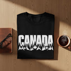 Black t-shirt with white "CANADA" text over a forest and maple leaf graphic.