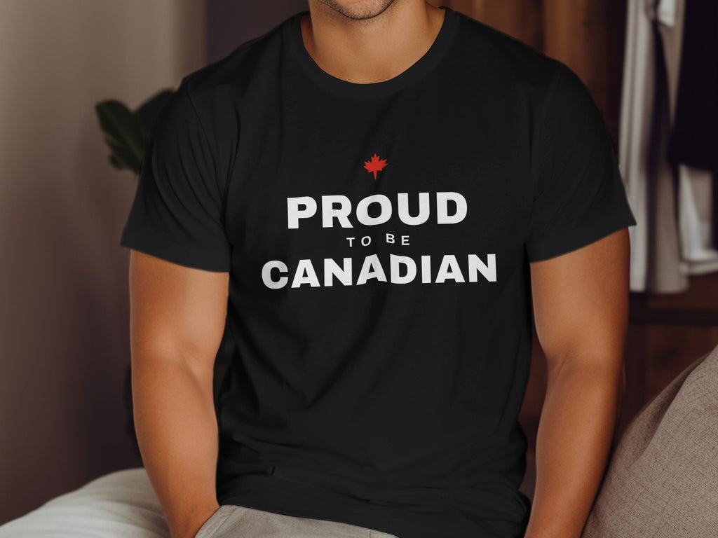 Black t-shirt with white text "PROUD TO BE CANADIAN" and a red maple leaf.