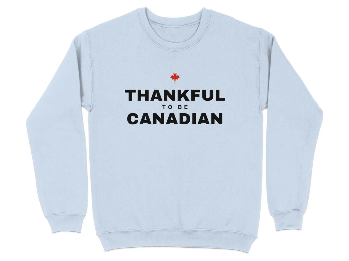 Light blue sweatshirt with black text "THANKFUL TO BE CANADIAN" and a red maple leaf.