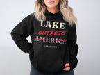 Black hoodie with text "LAKE ONTARIO AMERICA CORRECTED"