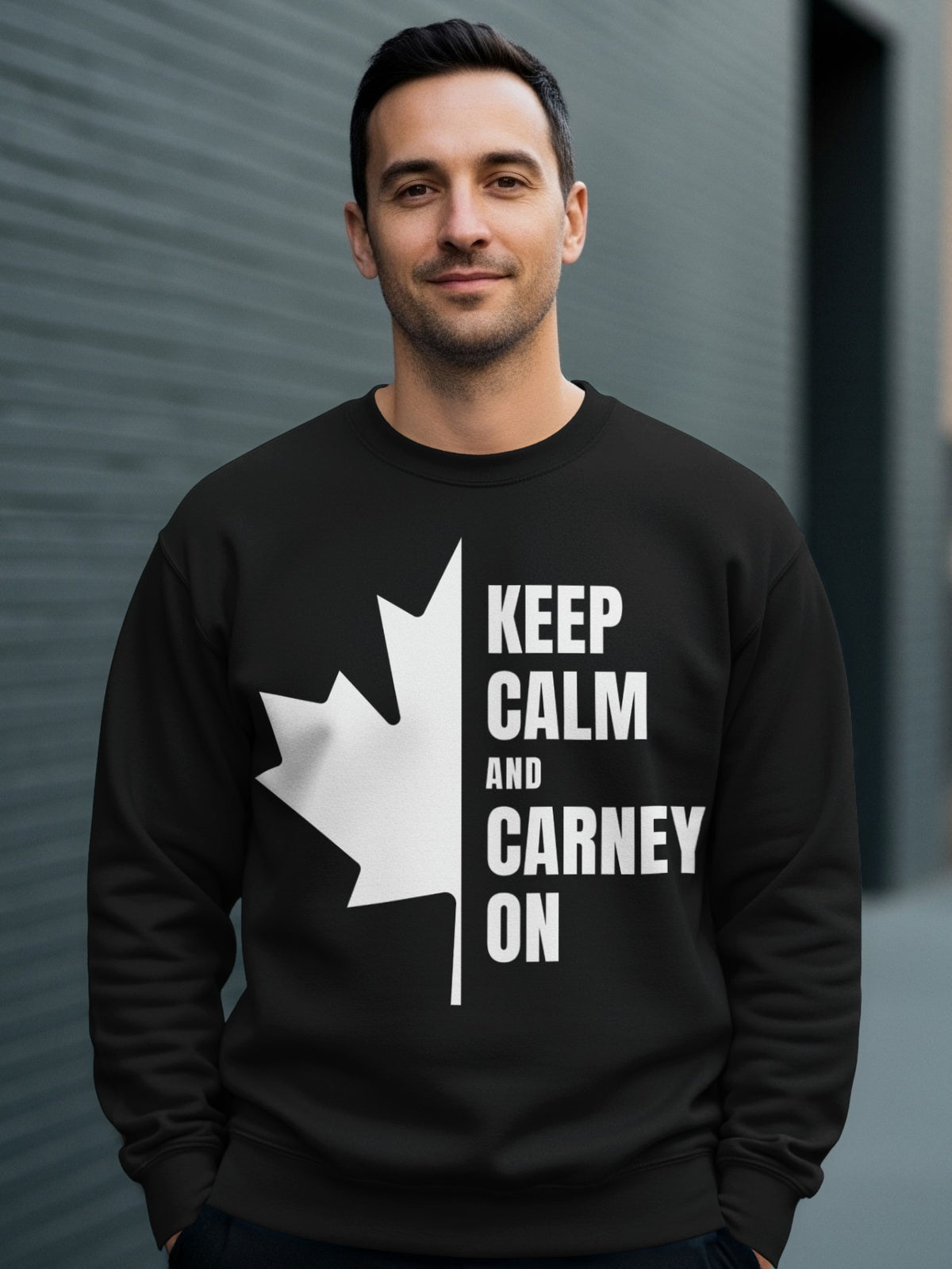 Black sweatshirt with white maple leaf and text "KEEP CALM AND CARNEY ON".