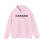 Pink hoodie with "CANADA EST. 1867" text and a maple leaf logo.
