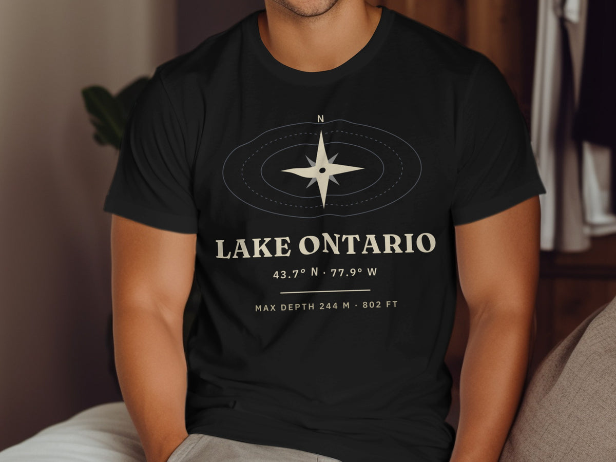 Black t-shirt with "LAKE ONTARIO" text, coordinates, and compass graphic.