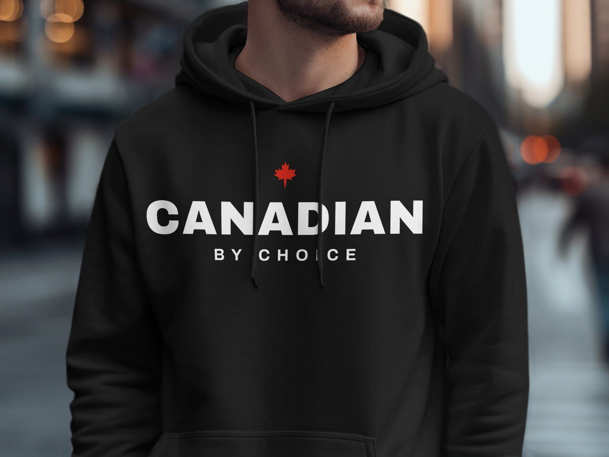 Black hoodie with white text "CANADIAN BY CHOICE" and a red maple leaf.