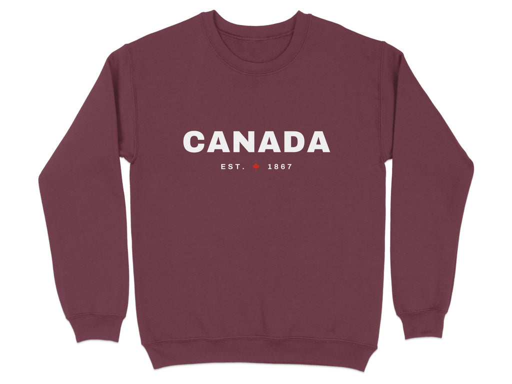 Maroon sweatshirt with "CANADA EST. 1867" and a maple leaf in white text.