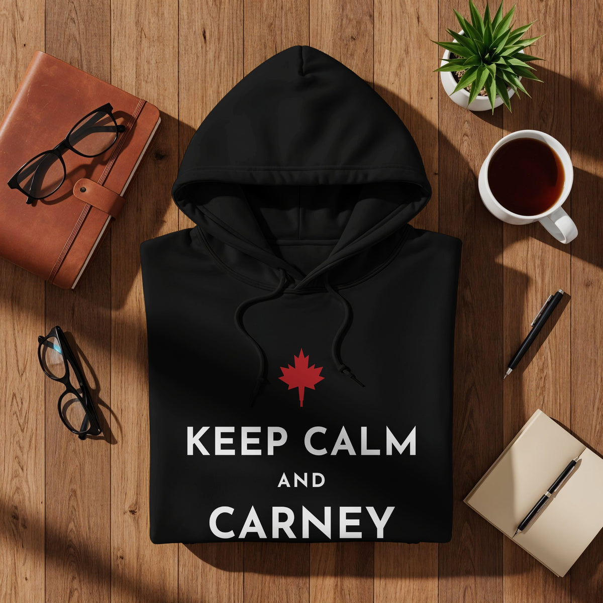 Black hoodie with "KEEP CALM AND CARNEY" text and red maple leaf logo.