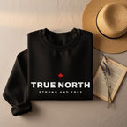 Black sweatshirt with "TRUE NORTH STRONG AND FREE" text and red maple leaf.