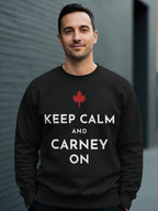 Black sweatshirt with red Canadian maple leaf and text "KEEP CALM AND CARNEY ON".