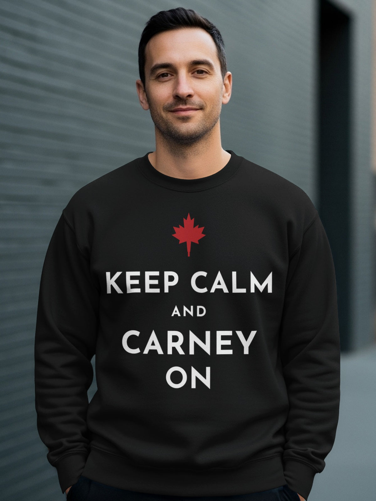 Black sweatshirt with red Canadian maple leaf and text "KEEP CALM AND CARNEY ON".