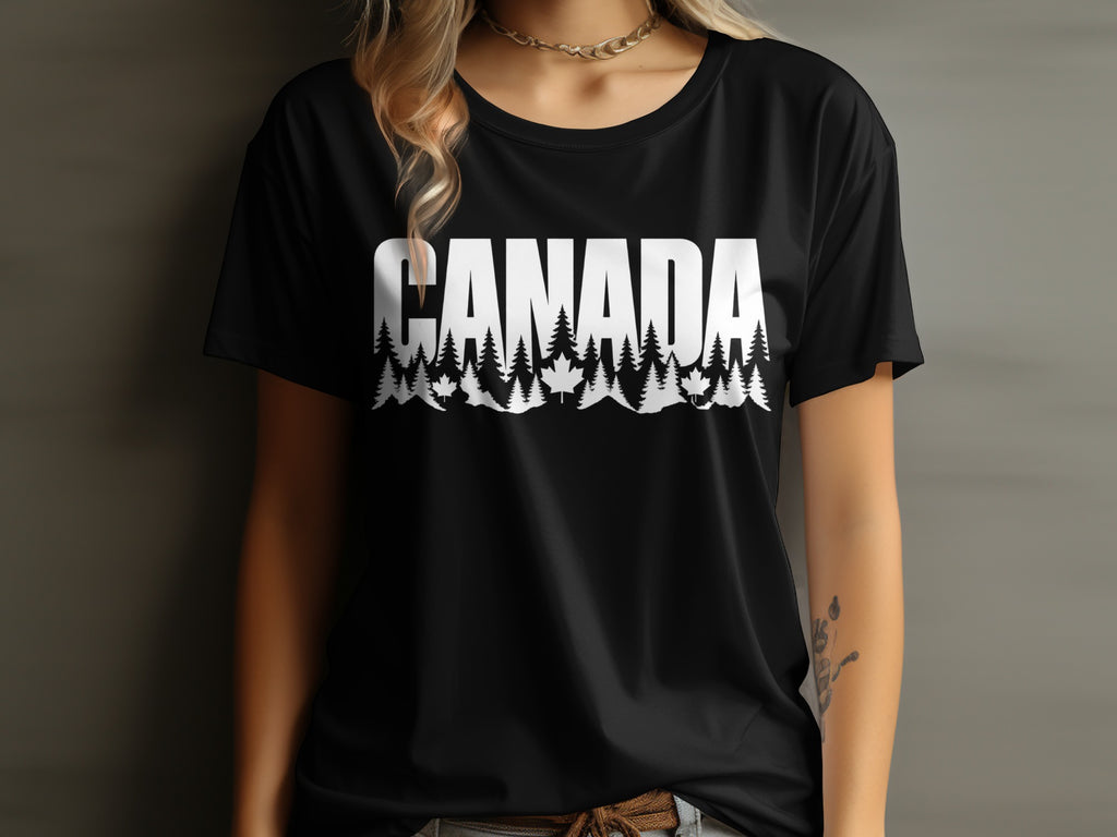 Black t-shirt with white text "CANADA" over a forest and maple leaf design.
