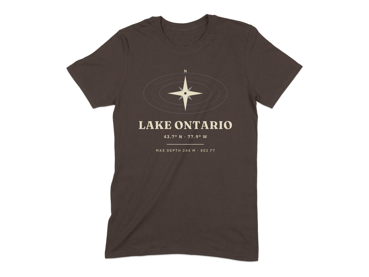 Brown t-shirt with graphic of compass and text "LAKE ONTARIO" and coordinates.