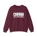 Maroon sweatshirt with white "CANADA" text and forest landscape graphic.